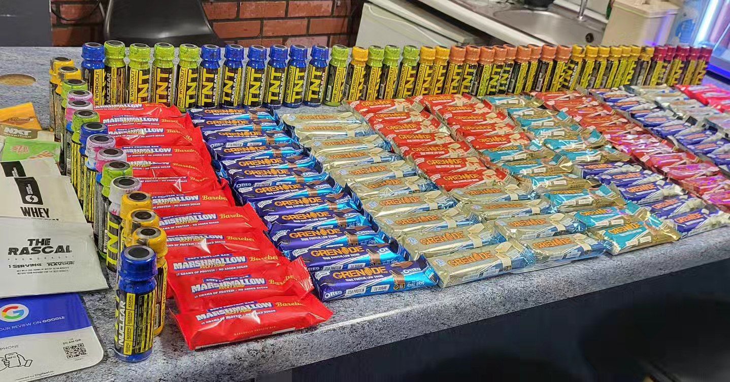A table filled with lots of different types of candy bars.