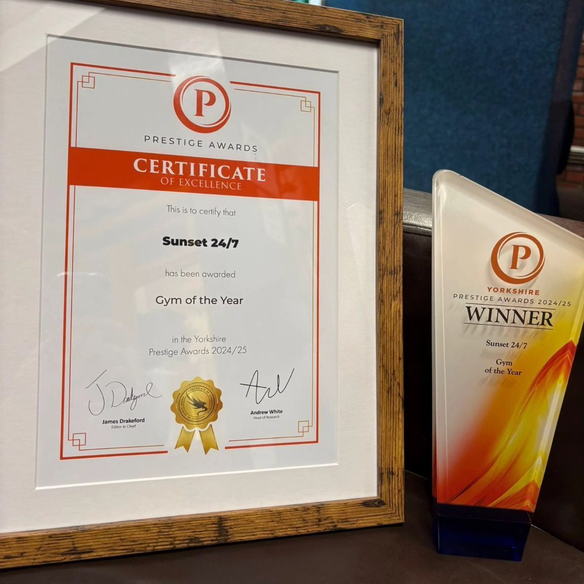 A framed certificate that says sunset 24/7 on it