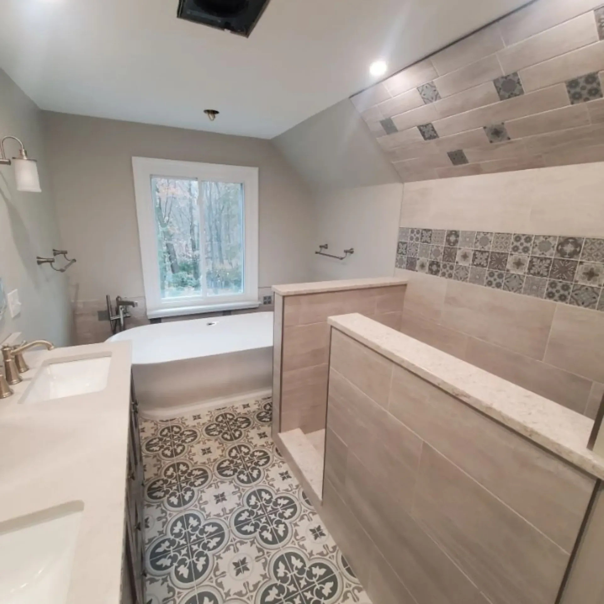 The 5 Contracting- A bathroom with a bathtub and a window