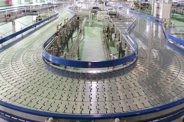 A Conveyor Belt In A Factory With A Blue Circle In The Middle — ADR Engineering in Collinsville, QLD