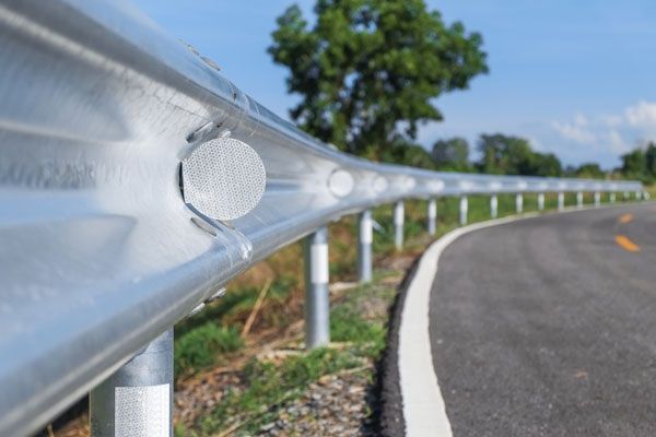 A Close Up Of A Metal Railing On The Side Of A Road — ADR Engineering in Collinsville, QLD