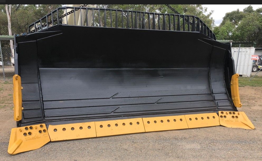 A Large Black And Yellow Bulldozer Bucket Is Sitting On The Ground — ADR Engineering in Collinsville, QLD