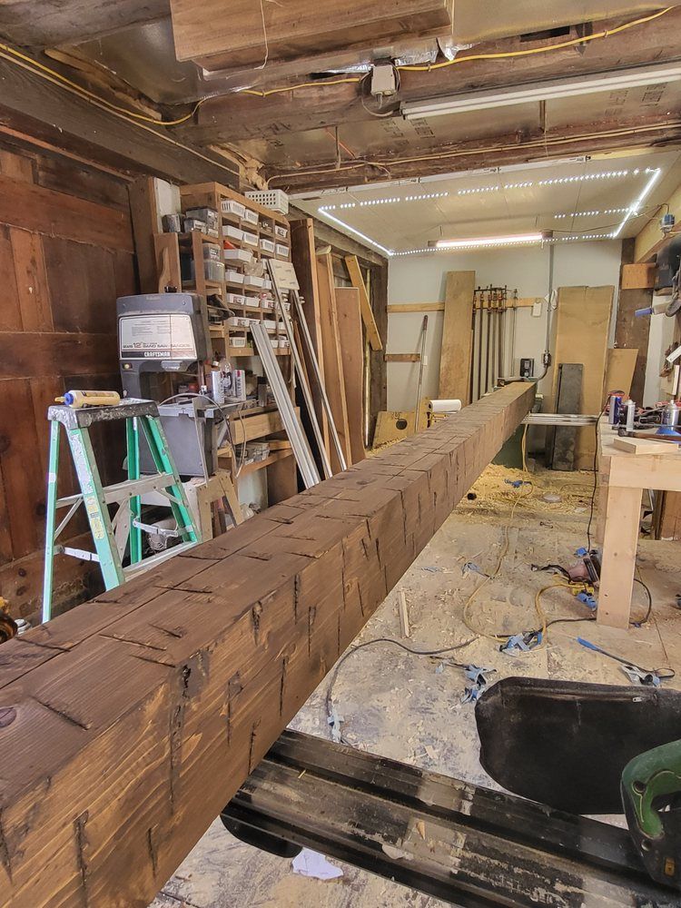 Wood beam being measured in a cluttered workshop under construction