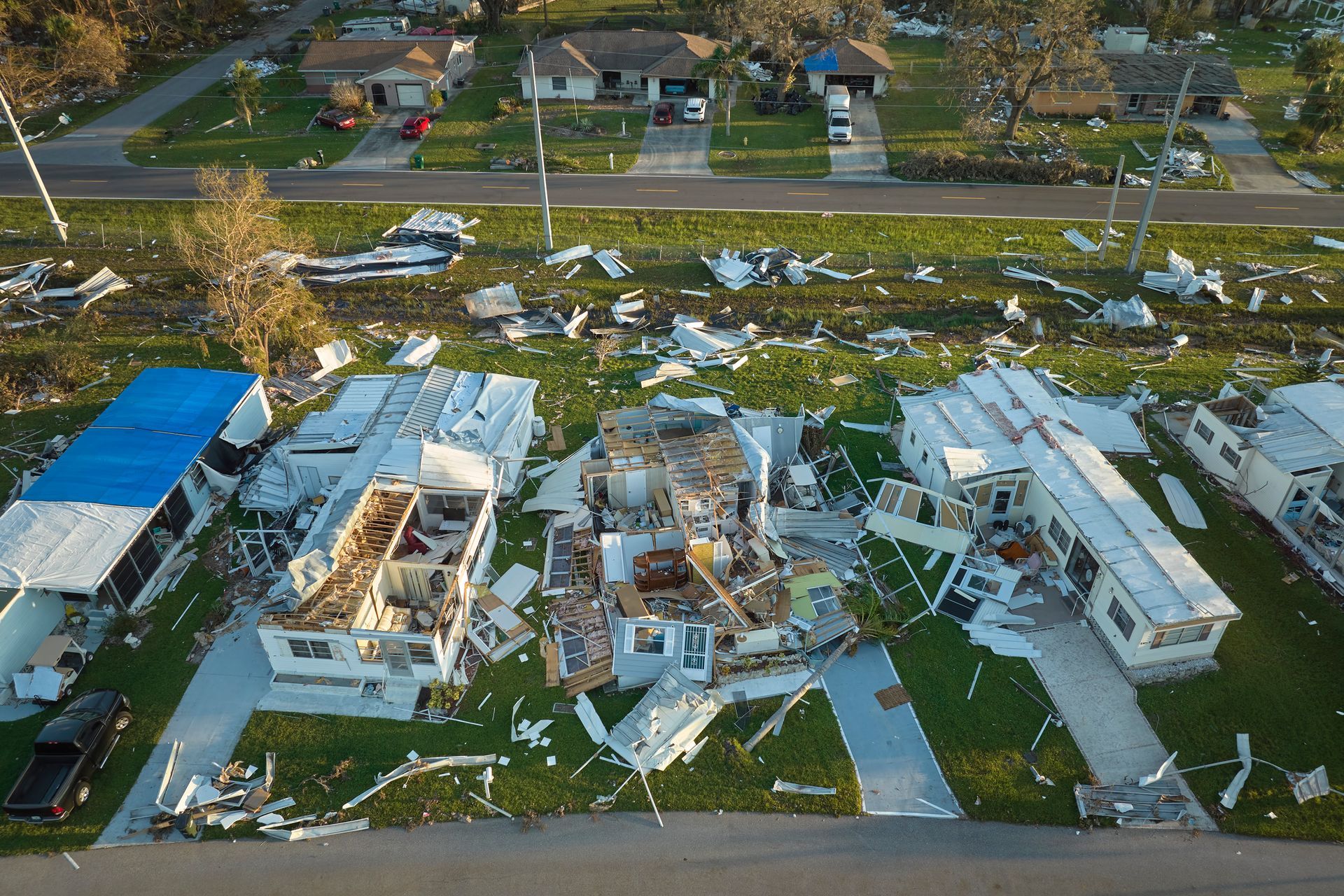 an aerial view of a damaged mobile home park .