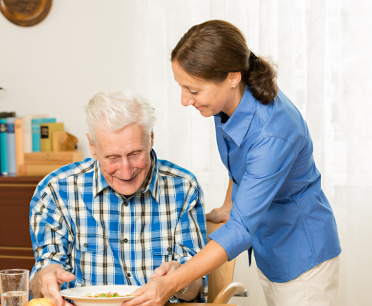 A caregiver helping with groceries.