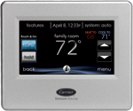 Carrier touchscreen thermostat displaying room temperature and control options.