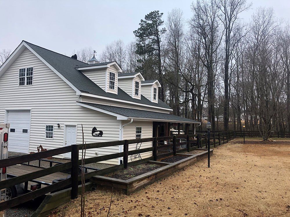 White farm house roof from Shield Roofing