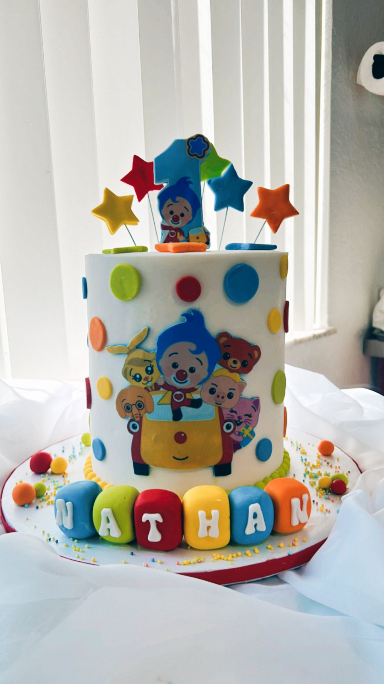 A birthday cake with the name nathan on it