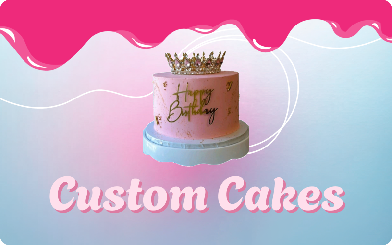 A pink birthday cake with a crown on top of it.