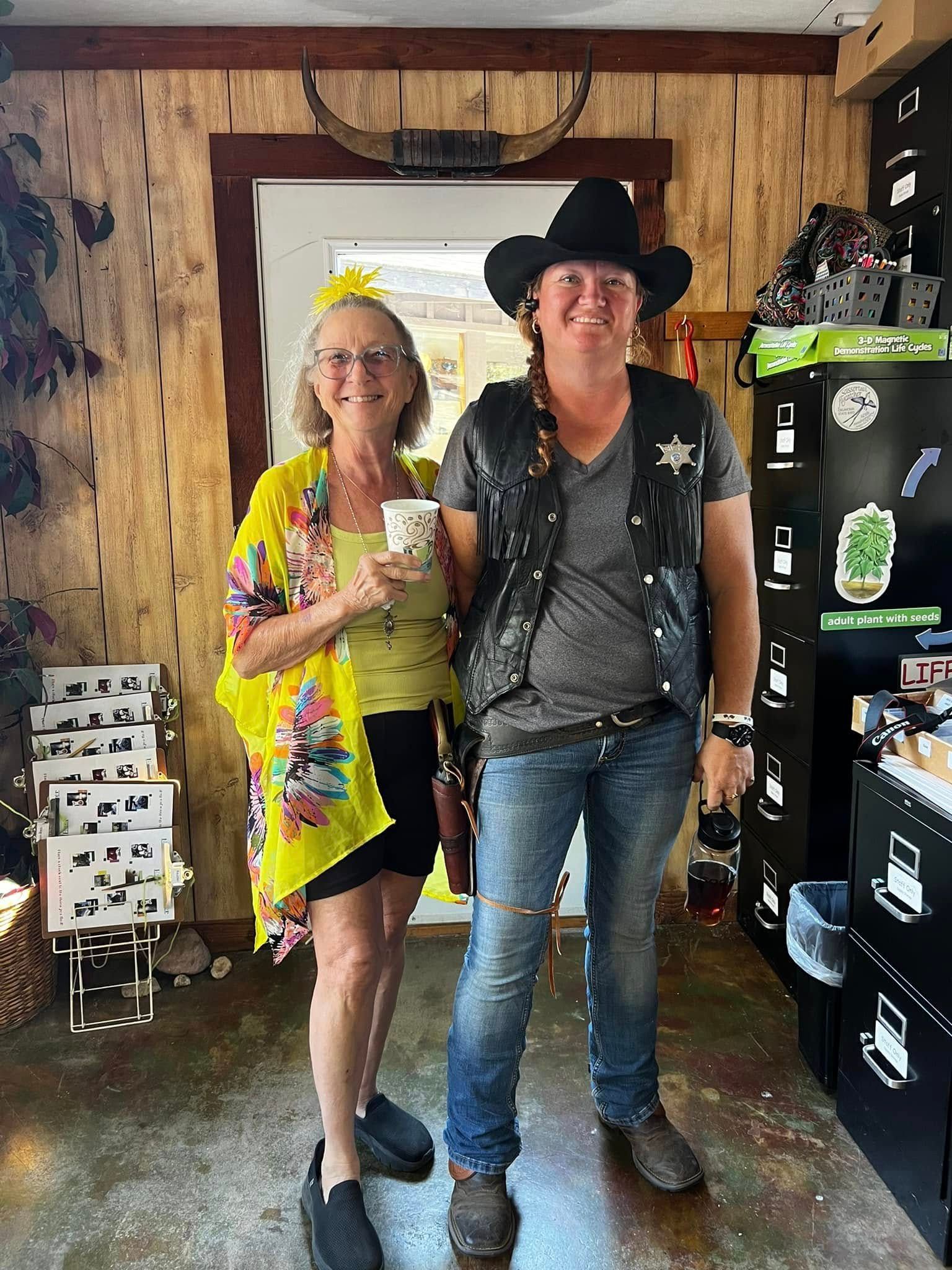 A man and a woman are standing next to each other in a room.