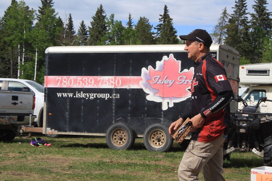 A man standing in front of a trailer that says lucky sky