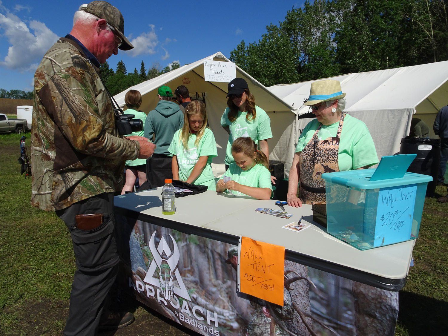 A group of people standing around a table that says approach