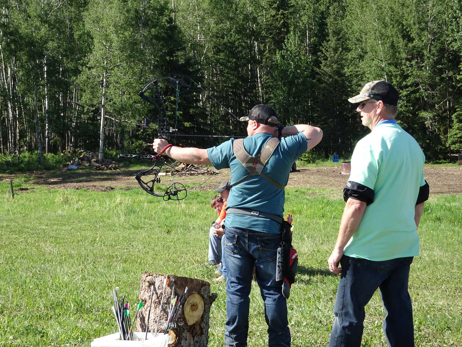 Man Shooting at an Archery target