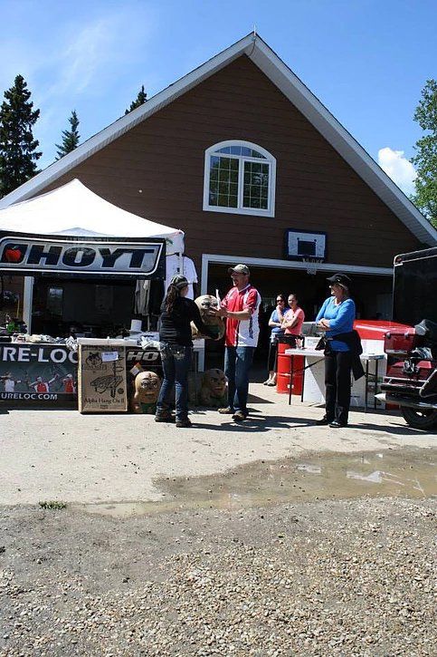 A group of people standing outside of a hoyt store