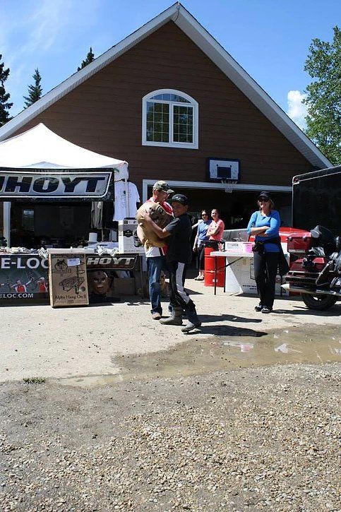 A group of people are dancing in front of a hayt store