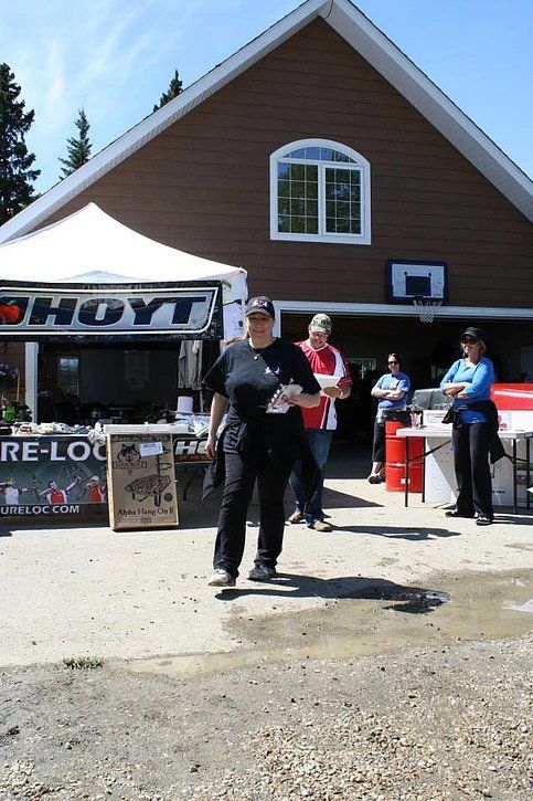 A woman stands in front of a hayt store