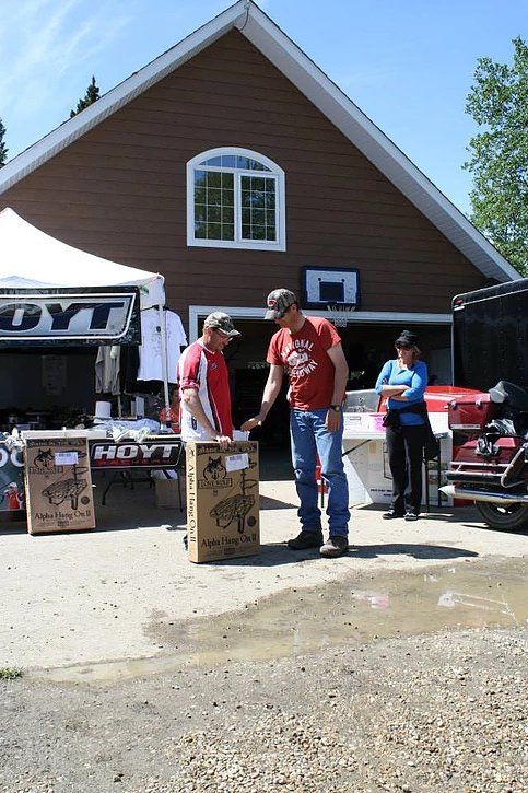 Two men are standing in front of a hayt store
