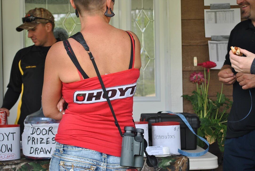 A woman wearing a red shirt with the word ohio on it