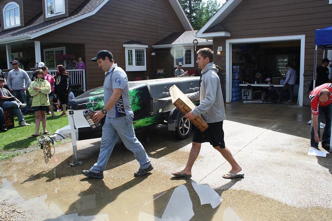 A group of people are walking in front of a house