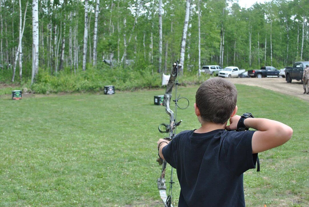 Archer shooting arrow at target