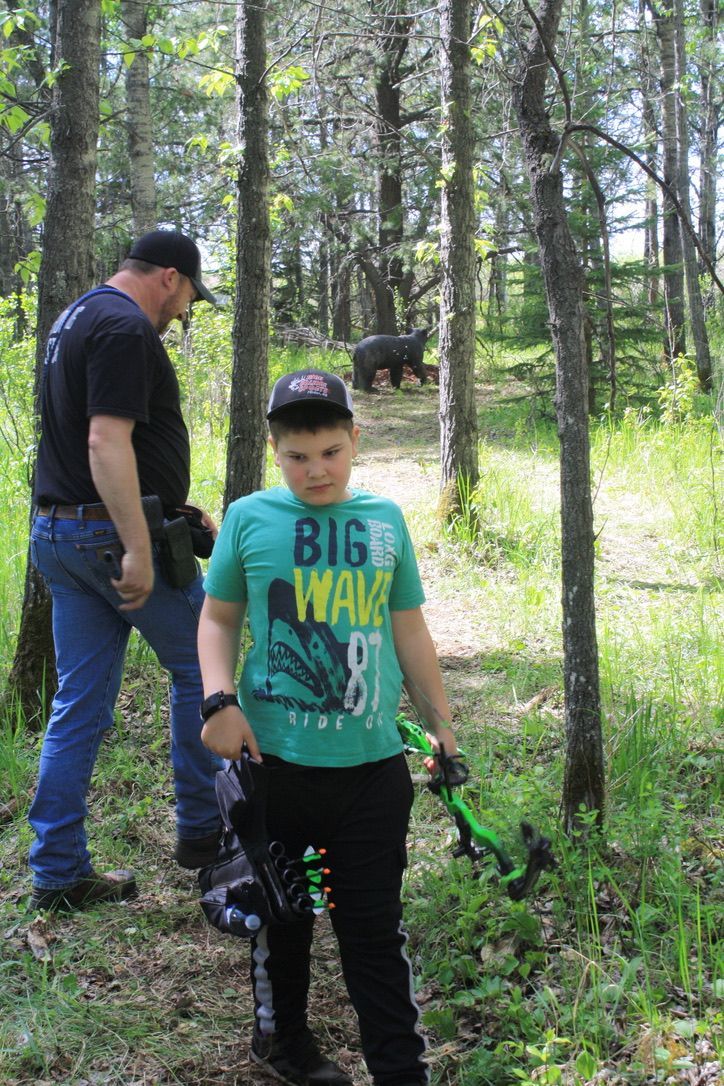 Archer shooting arrow at target