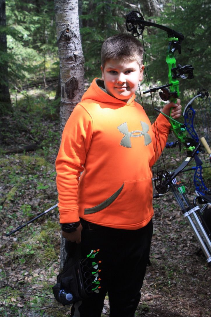 Archer shooting arrow at target