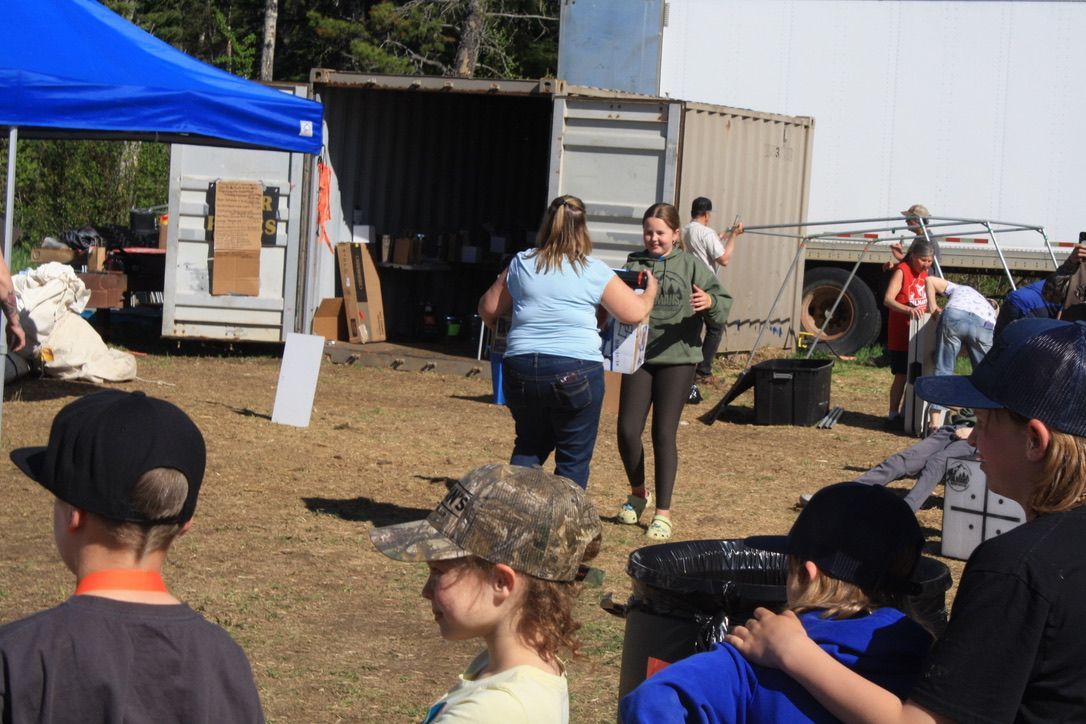 A group of people are playing paintball in a field.