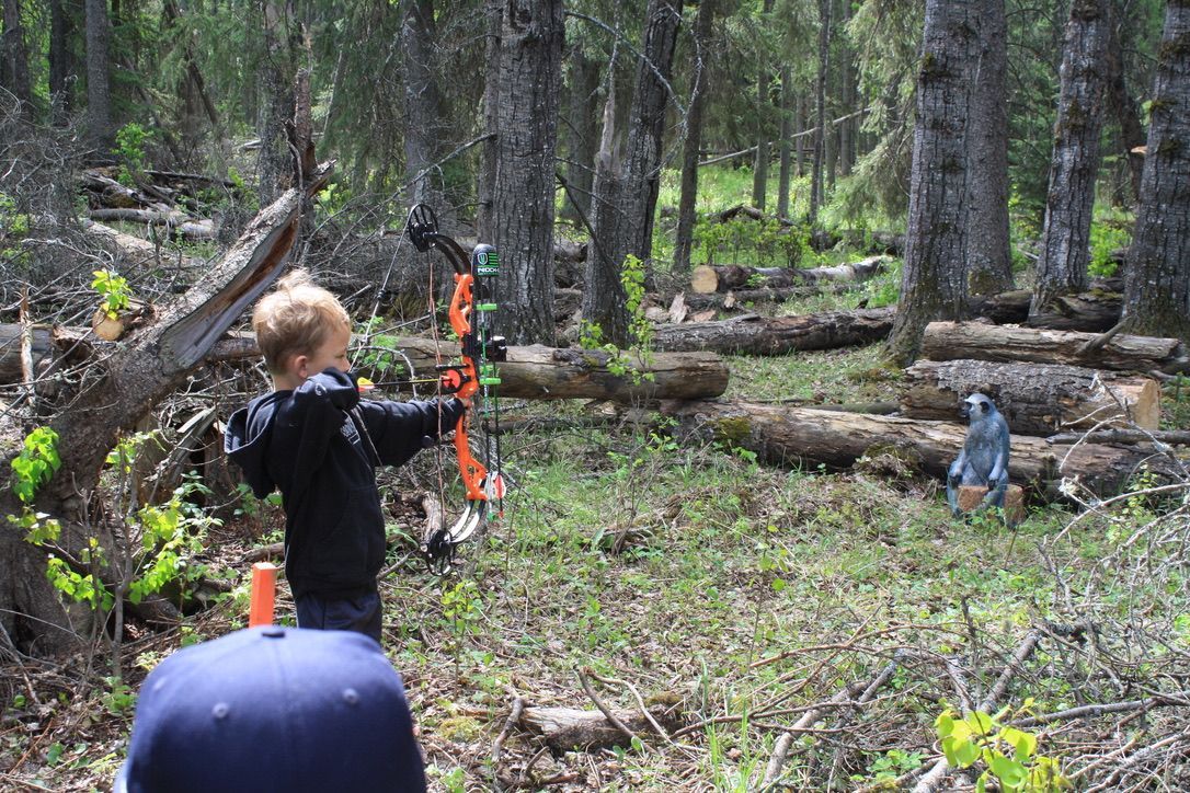 A young Archer shooting arrow at target