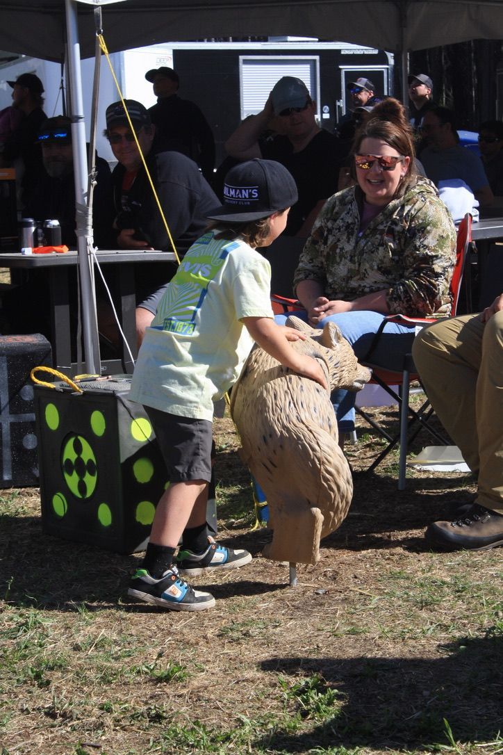 Archer shooting arrow at target