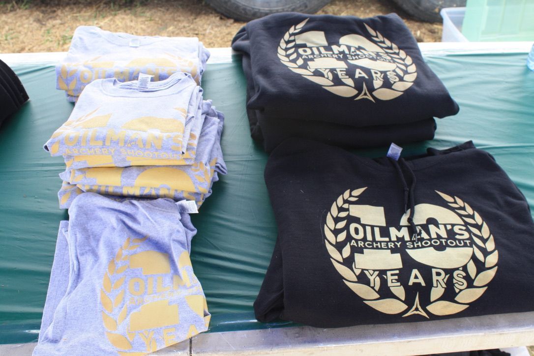 A stack of oilman 's shirts on a table