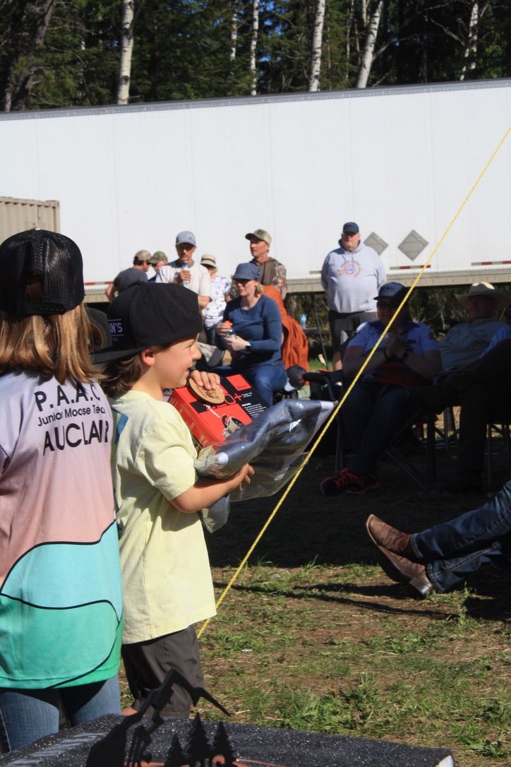 A boy wearing a shirt that says p.k.a. on it