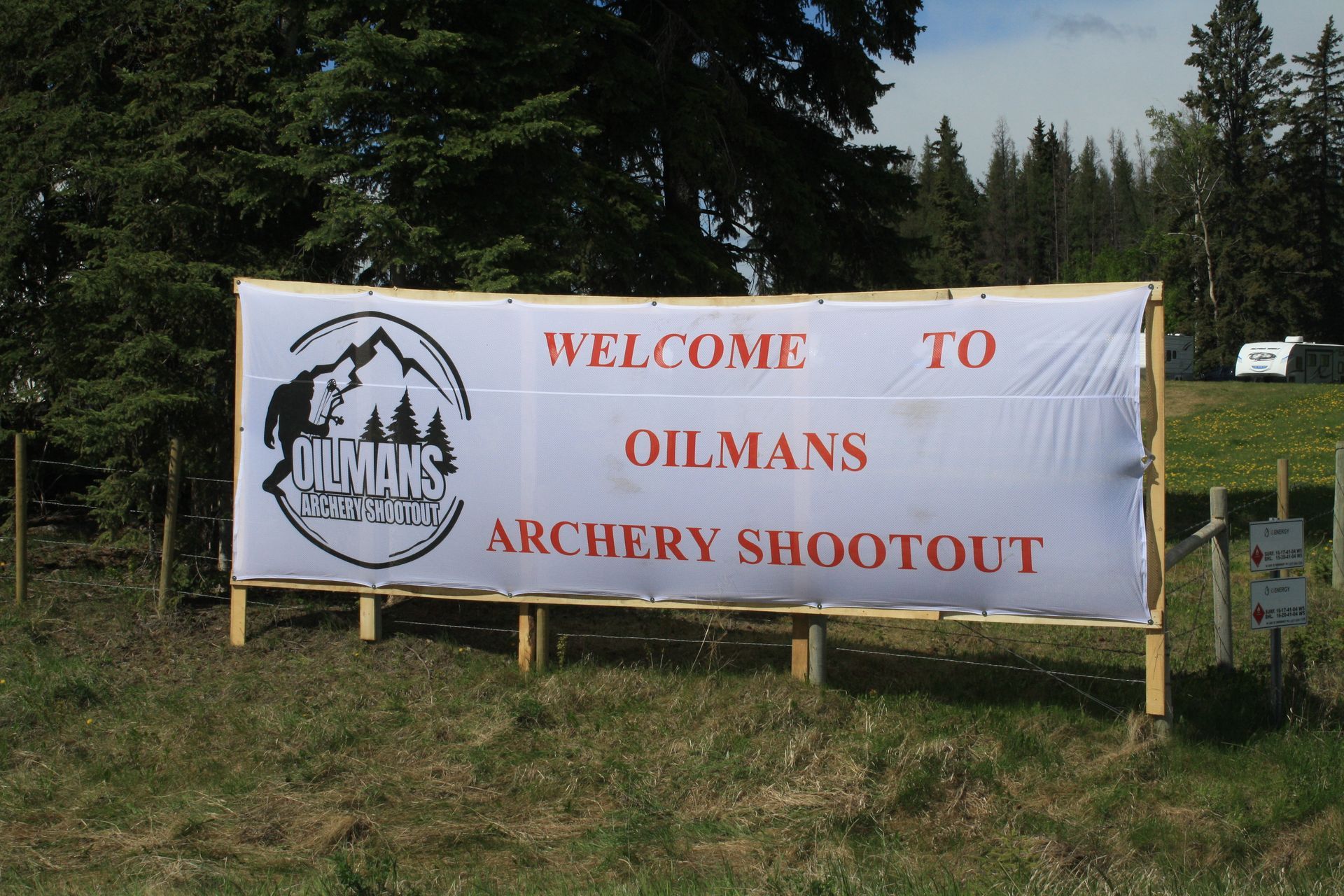 A sign that says welcome to oilmans archery shootout