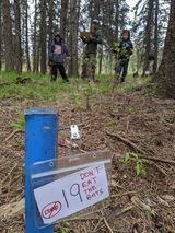 A blue pipe in the middle of a forest with a sign on it that says `` do n't eat the bats ''.