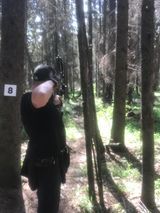 Man shooting arrow at target