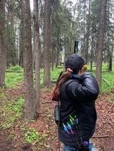 Archer shooting arrow at target