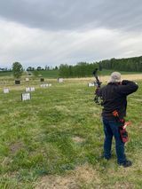 Archer shooting arrow at target