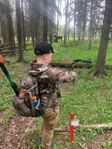 Archer shooting arrow at target