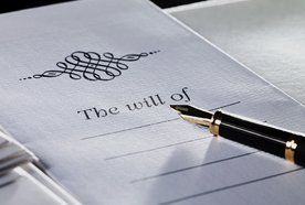 A fountain pen on top of a will
