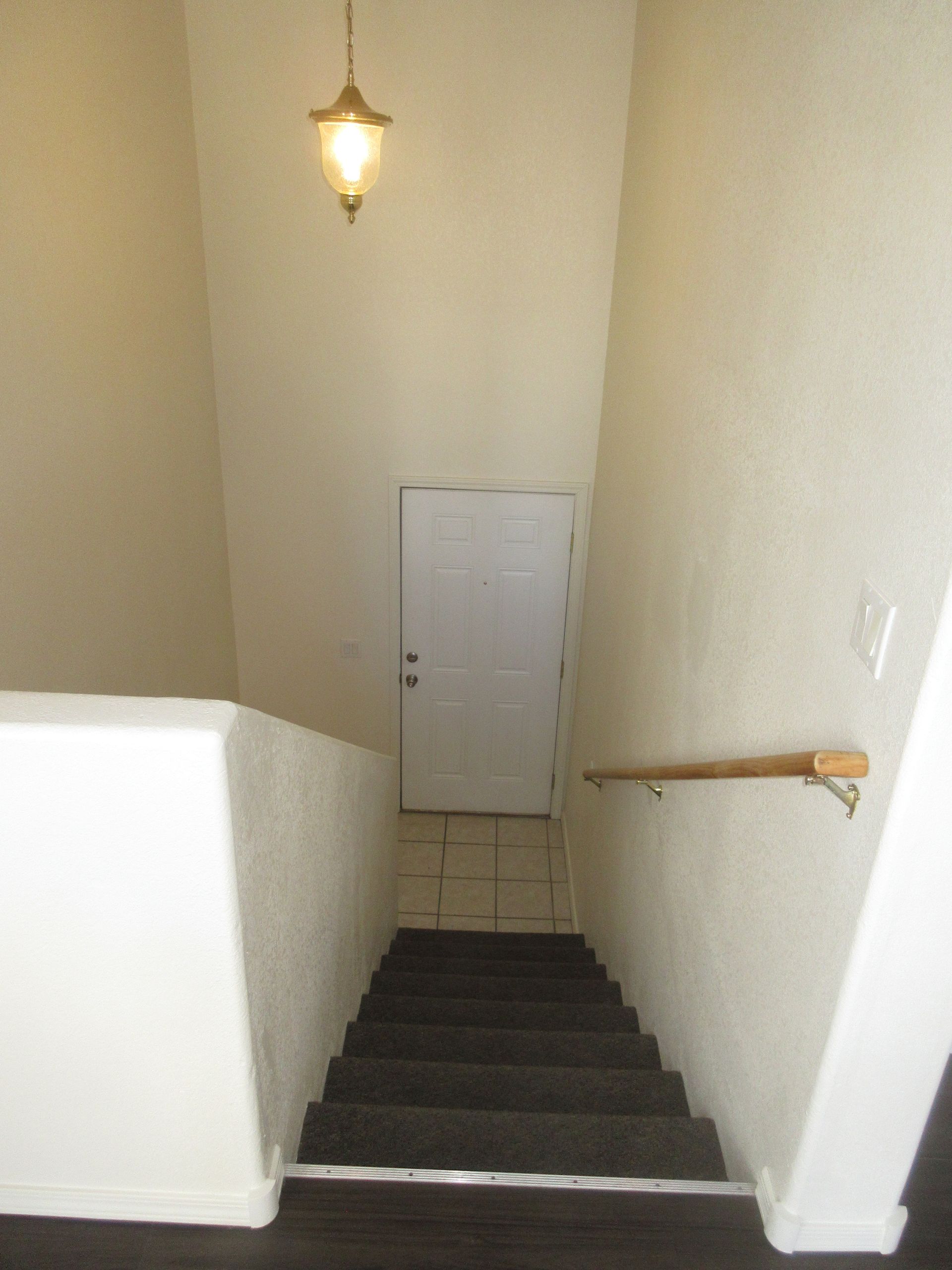 Stairs leading up to a door in a house