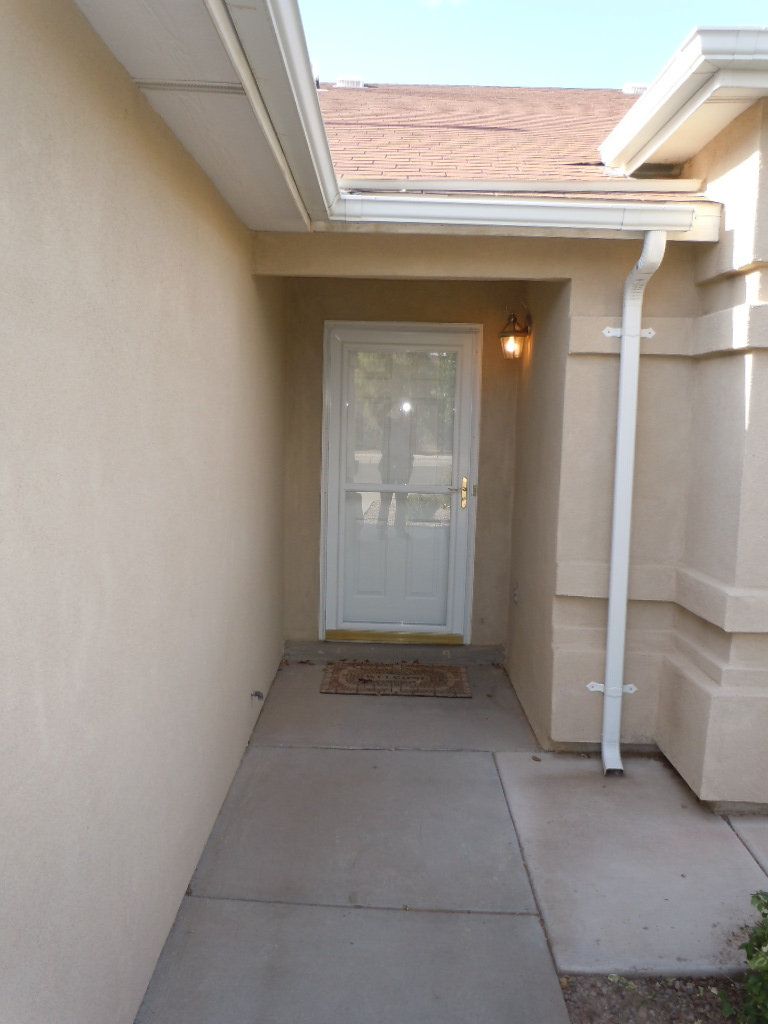 A walkway leading to the front door of a house