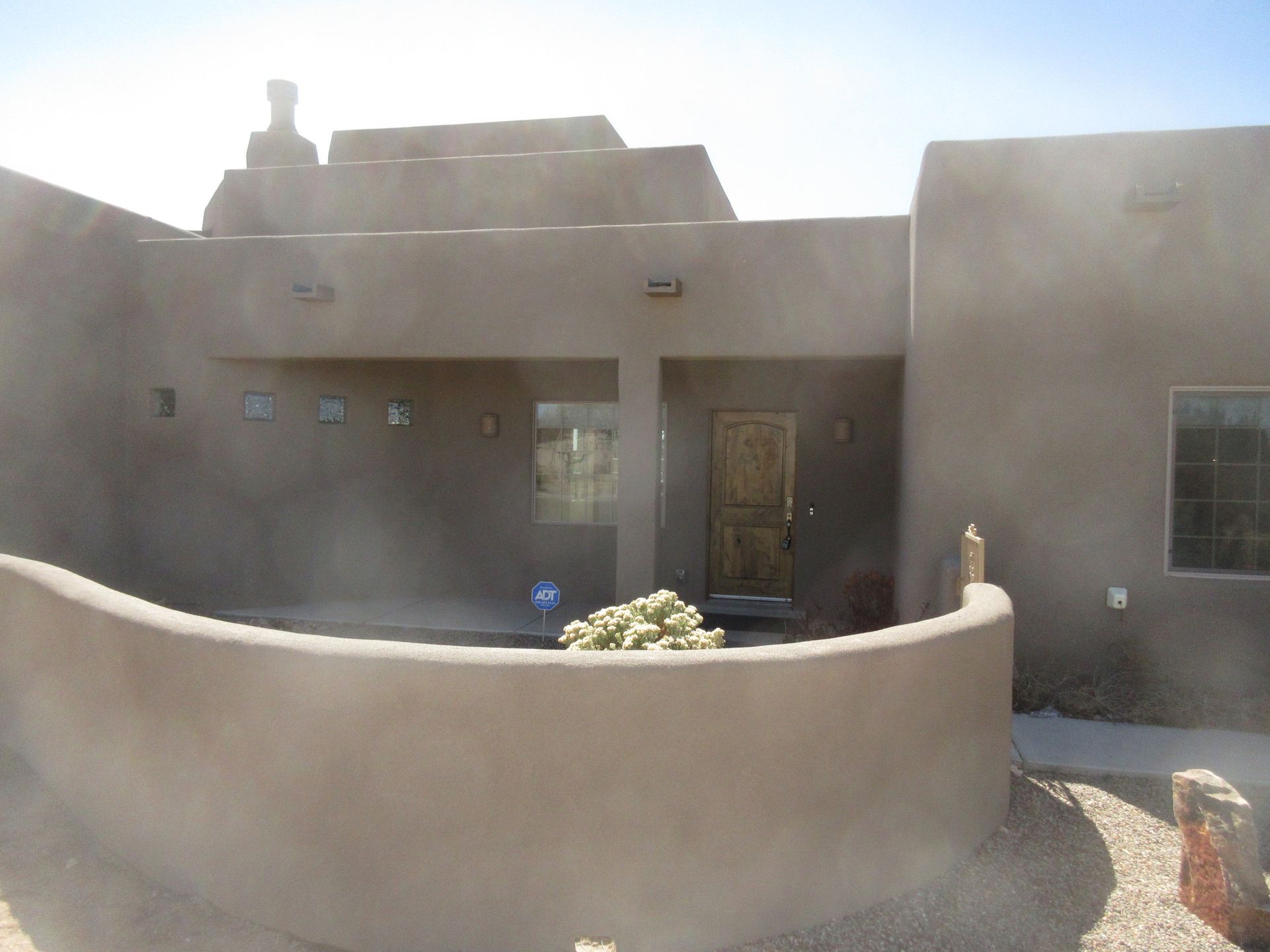 The outside view of the main entry of a rental property in Placitas, NM with Advantage Pointe Properties that is 3BDR/2BA/3CG