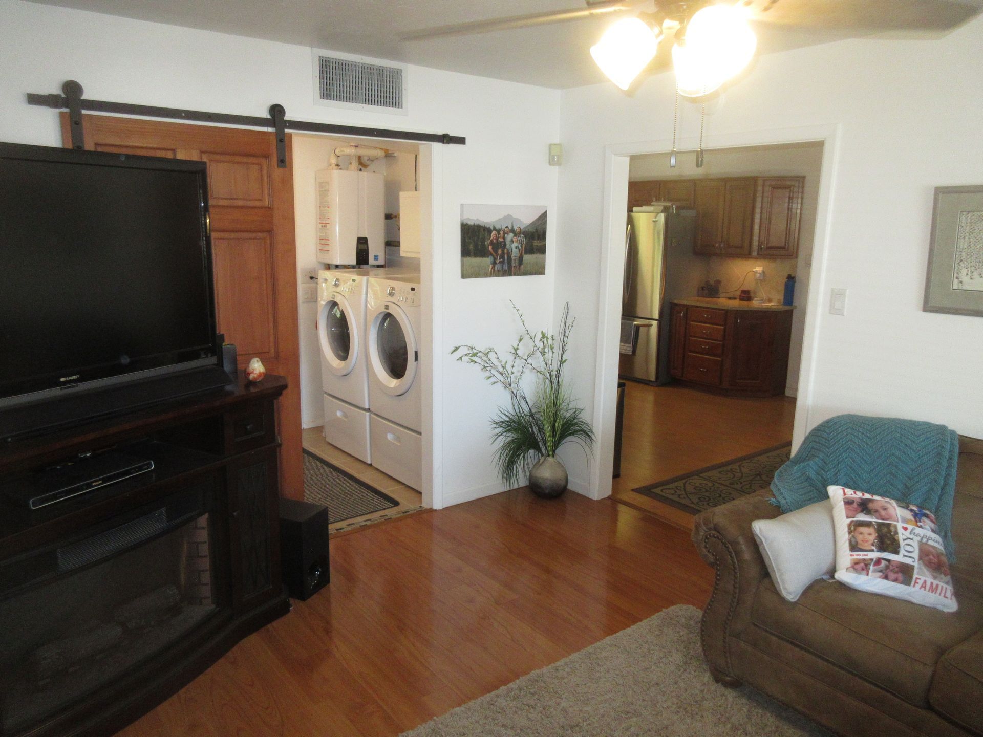 A living room with a couch and a flat screen tv