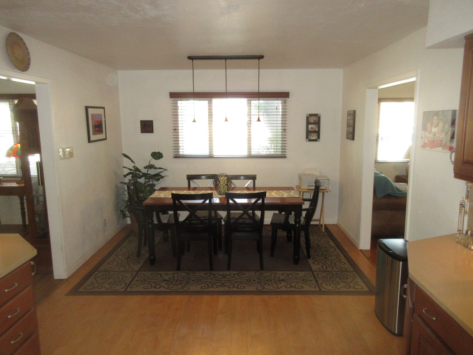 A dining room with a table and chairs in it