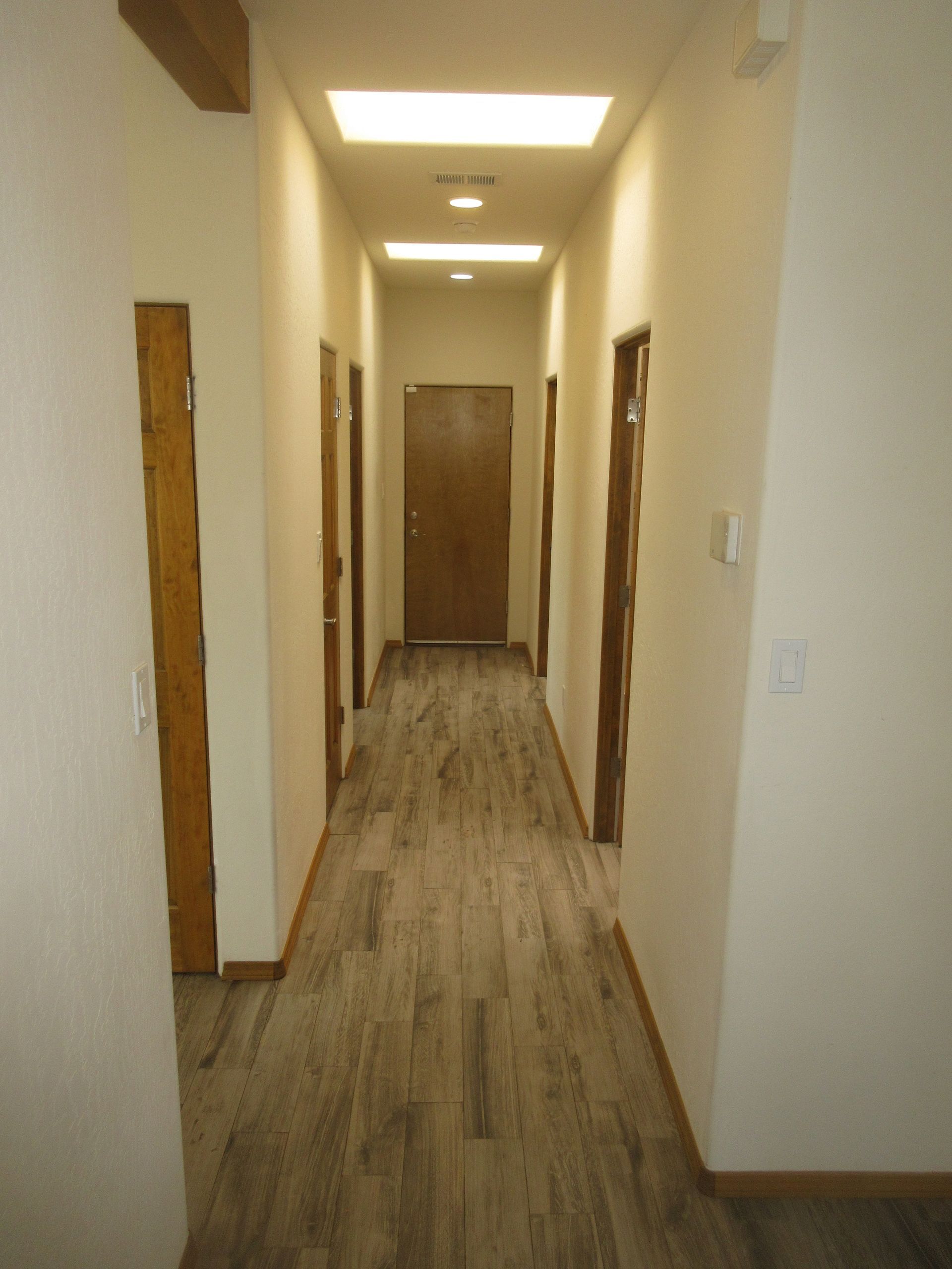 Inside view of the main hallway of a rental property in Placitas, NM with Advantage Pointe Properties that is 3BDR/2BA/3CG