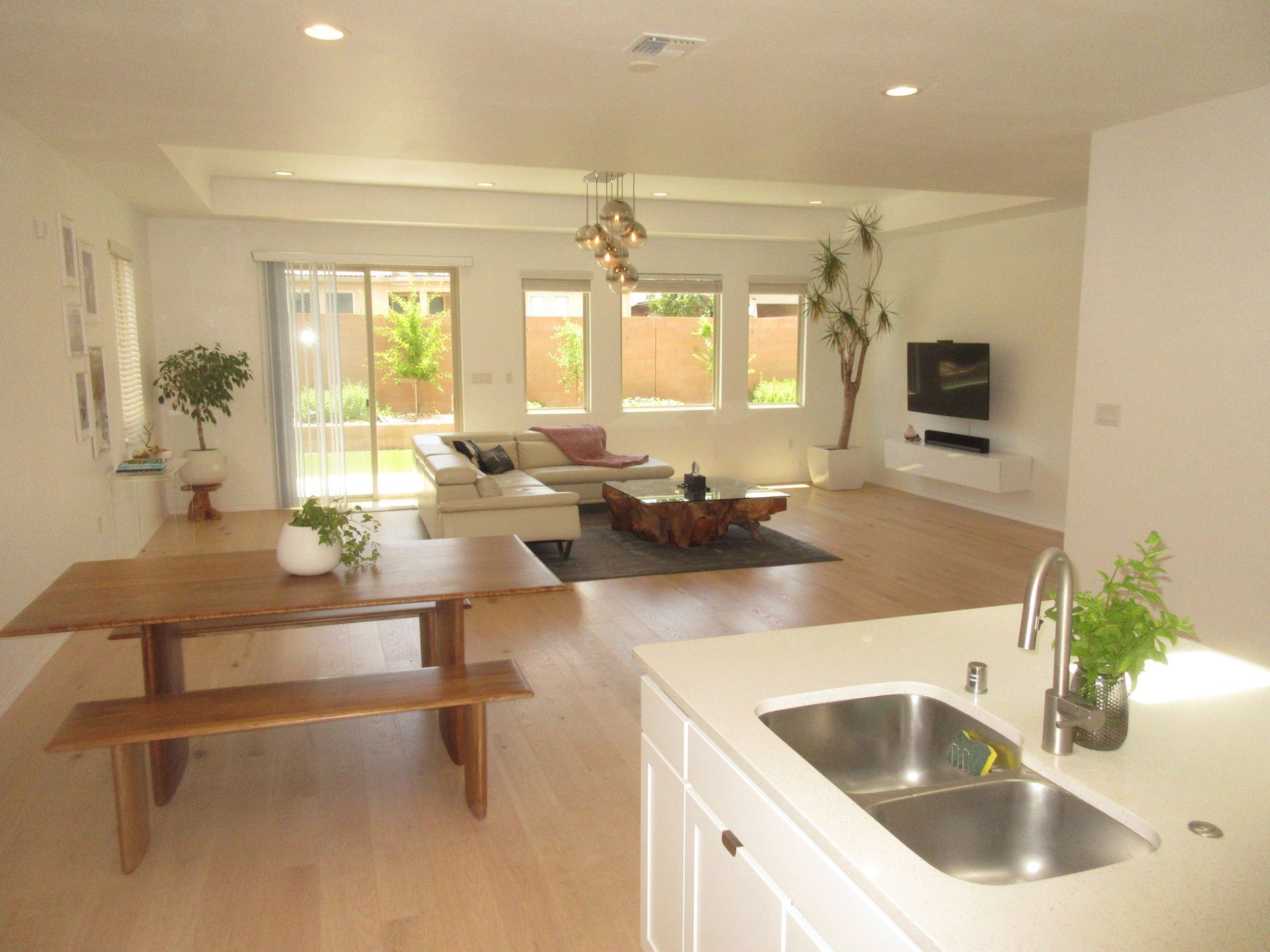 A kitchen with a sink and a table in it