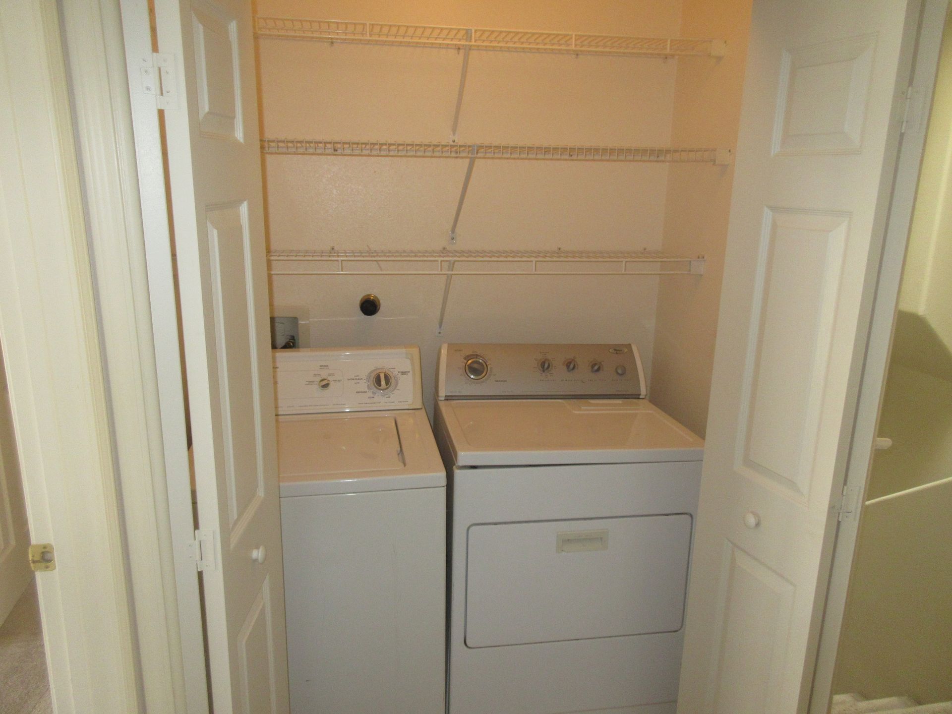 A laundry room with a washer and dryer in it