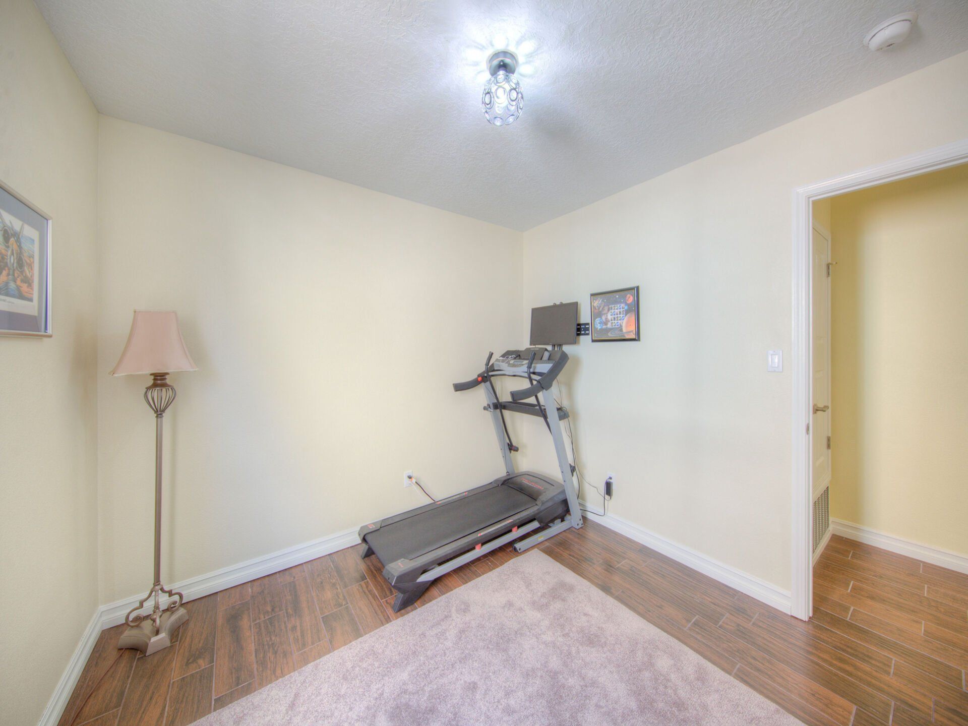 There is a treadmill in the middle of the room.