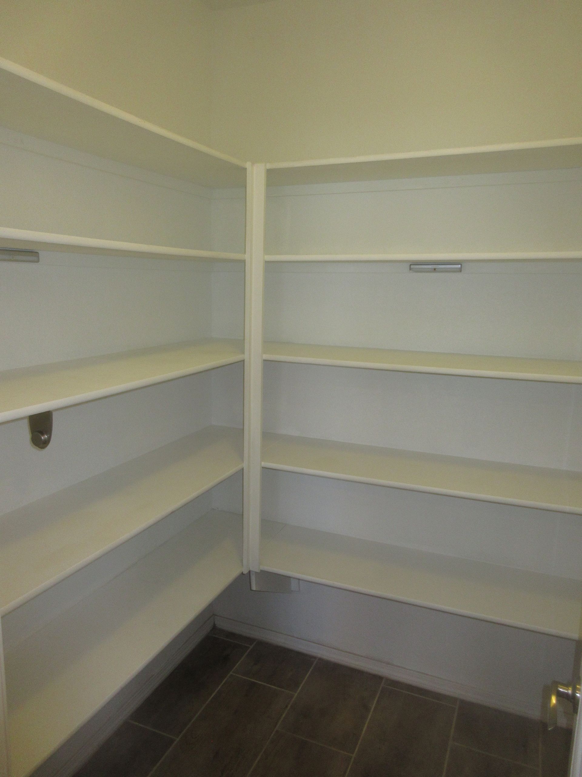 There are a lot of shelves in this room.