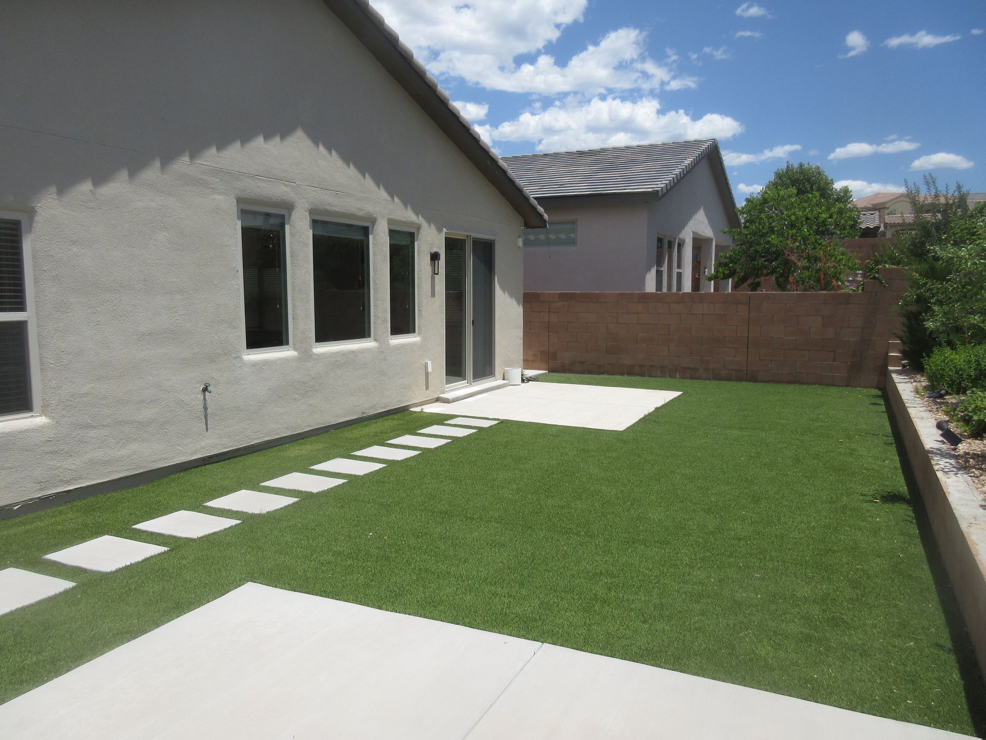 A house with a lawn in front of it