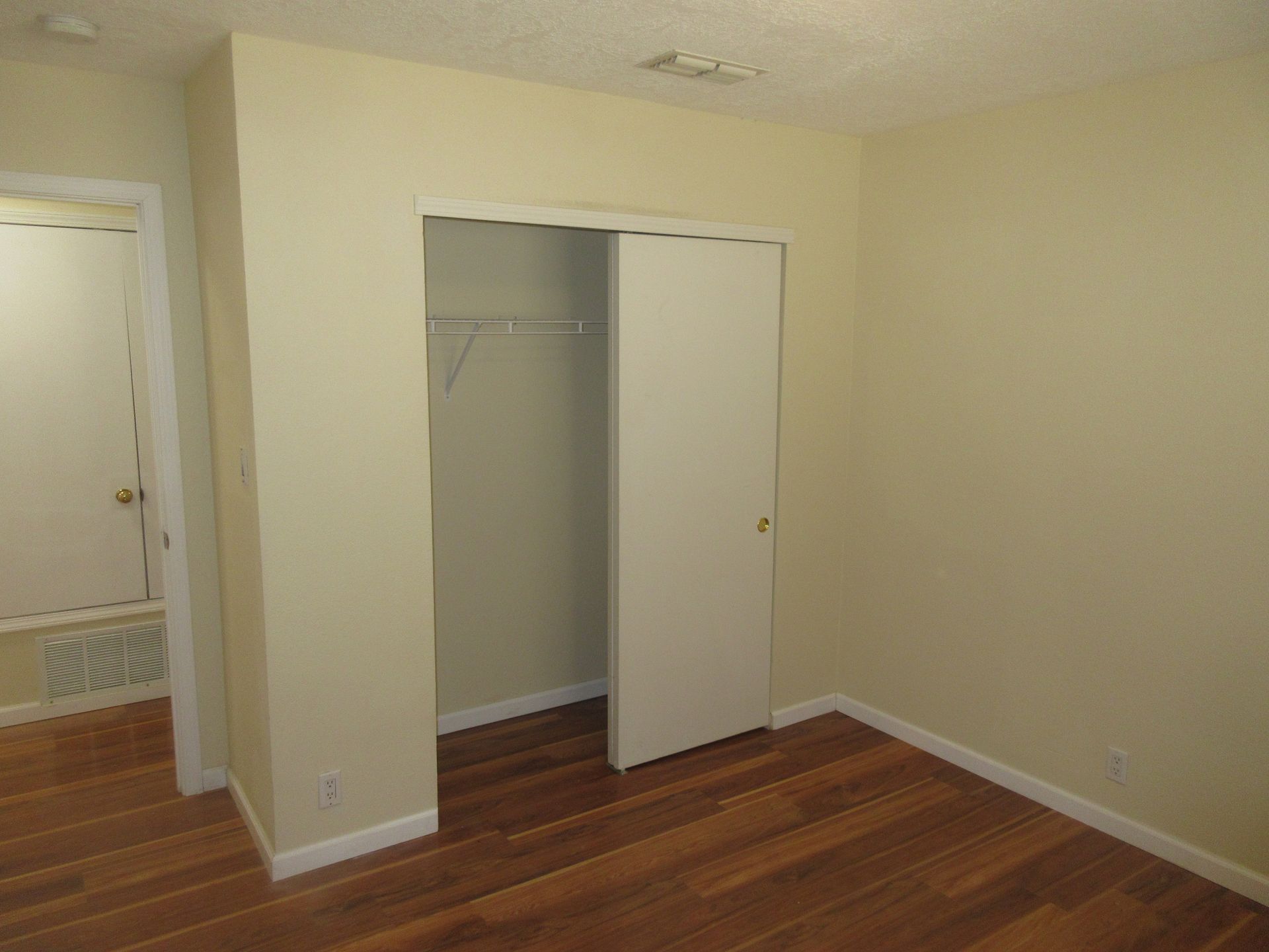There is a closet in the middle of the room.